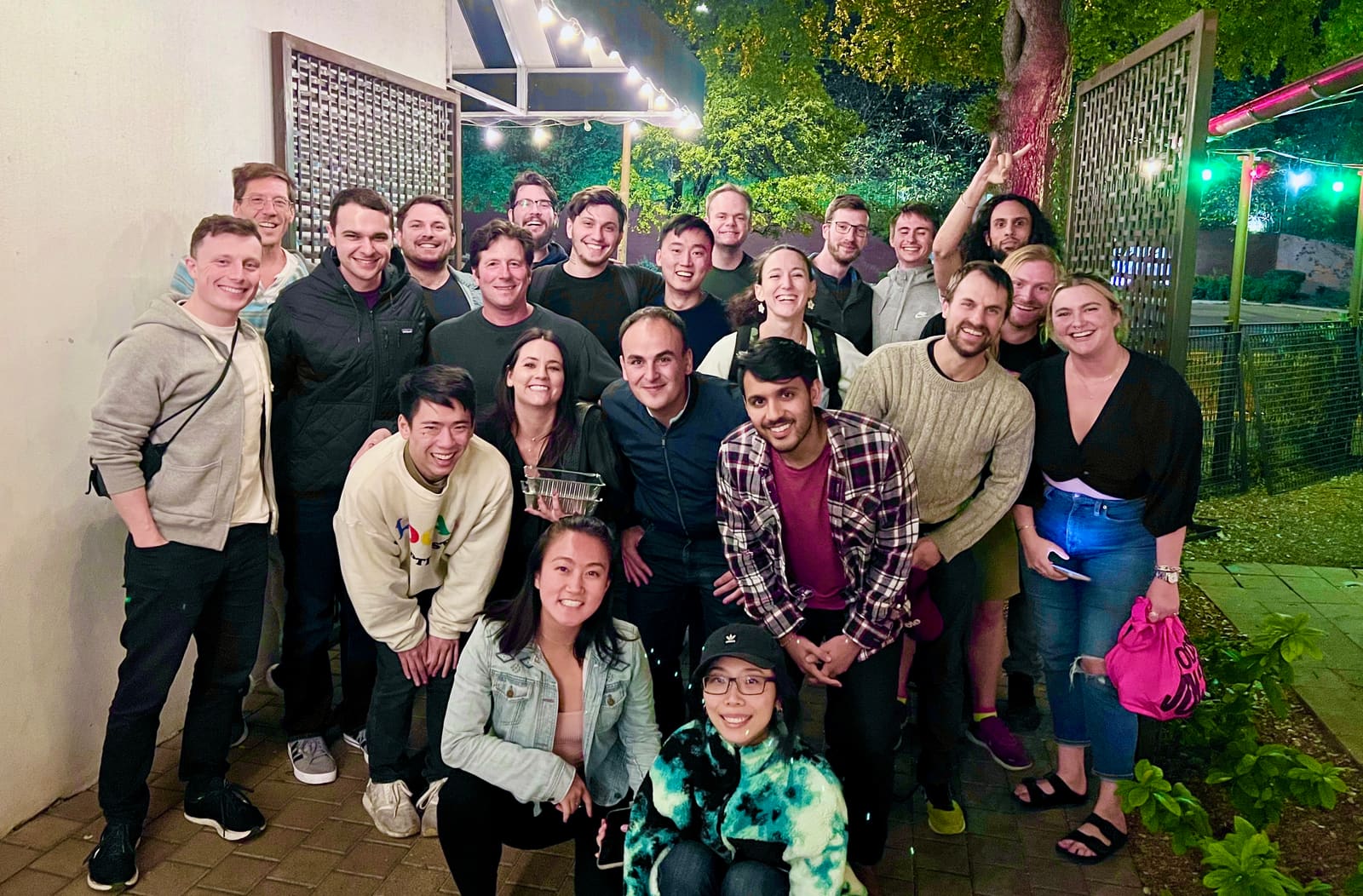 The OP Labs team gathered outdoors